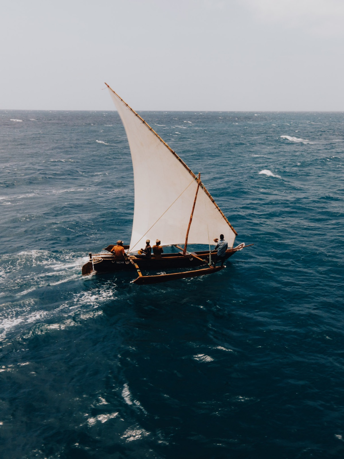 Traditional Zanzibar dhow sailing on blue Indian Ocean waters
